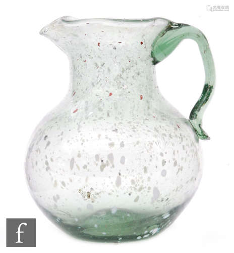 A large late Georgian Nailsea jug of ovoid form with collar neck and applied loop handle with lower