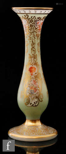 A late 19th Century Richardson's glass vase of footed baluster form in opaline with green and