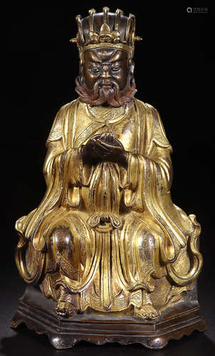 A GILT BRONZE TAOISM CHARACTER ORNAMENT