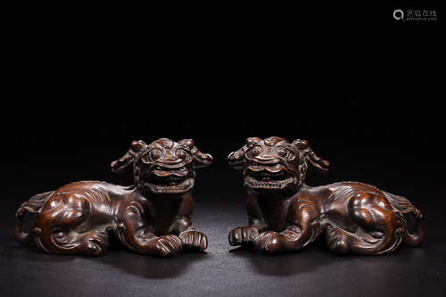 A 'TWO-PIECE' SET  OF CHENXIANG WOOD LION ORNAMENT