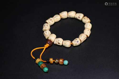 AN OLD SPIRIT BONE BUDDHA BEADS