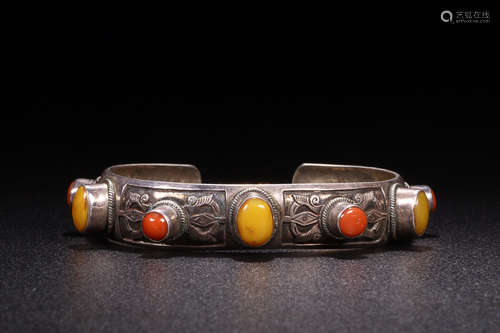 A SILVER GEM AND CORAL EMBEDED BANGLE