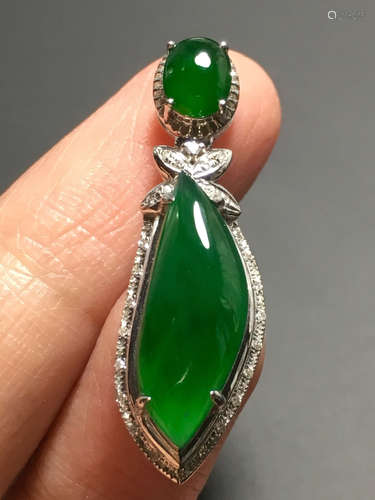 AN ICE SUN GREEN JADEITE FREE SHAPED PENDANT