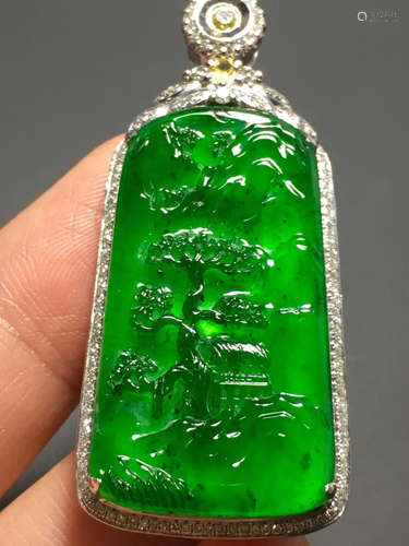 AN ICE SUN GREEN JADEITE LANDSCAPE PENDANT