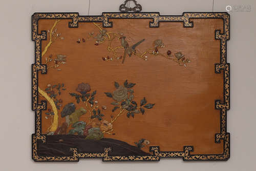 A WOOD SCREEN WITH TREASURE EMBEDDED