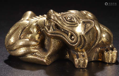 A GILT BRONZE AUSPICIOUS BEAST PAPERWEIGHT