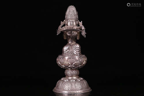 A SILVER GUANYIN SULPTURE