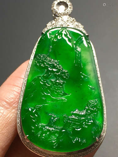 AN ICE SUN GREEN JADEITE LANDSCAPE PENDANT