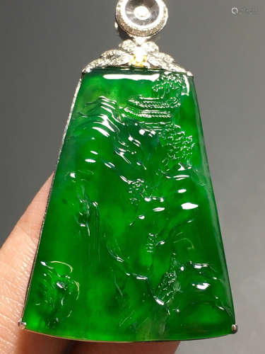 AN ICE SUN GREEN JADEITE LANDSCAPE PENDANT