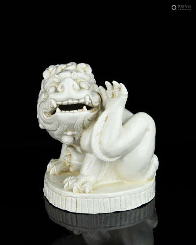 A Chinese White Glazed Porcelain Foo-Dog Incense Burner