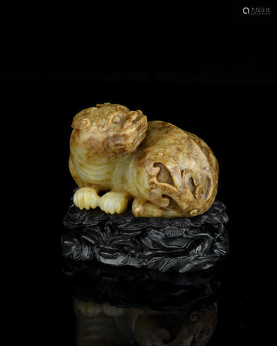 A Chinese Carved Jade Foo-Dog