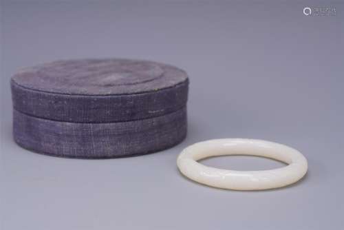 A Finely Carved Chinese White Jade Bracelet