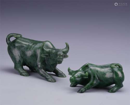 A Finely Carved Spinach Green Jade Bull Shaped Figure