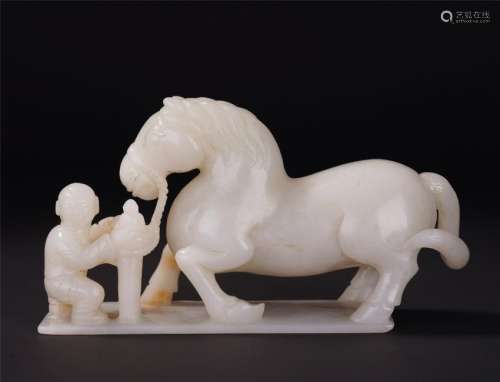 A Rare Chinese White Jade Carving of Man and Horse