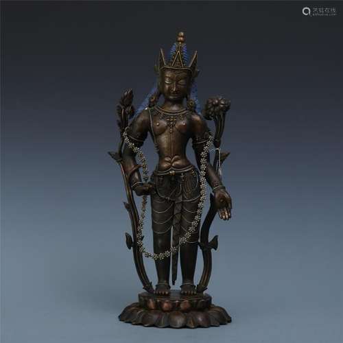 A Chinese Silver and Gold Inlaid Bronze Figure of