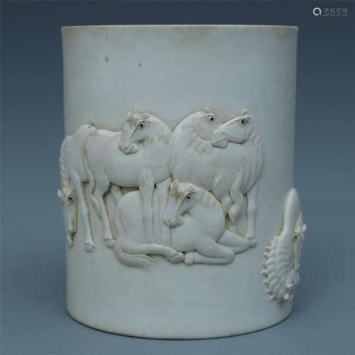 A Finely Carved Blanc de Chine Horse Brush Pot
