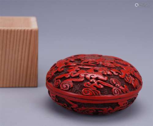 A Chinese Carved Cinnabar Lacquer Box and Cover