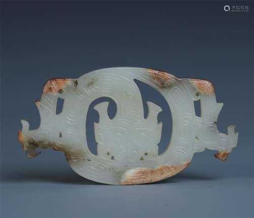 A Chinese Carved White and Russet Jade Ornament with