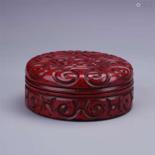 A Finely Carved Red Lacquer Box and Cover