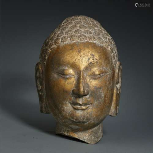 A Chinese Gold Lacquered  Stone Buddha's Head