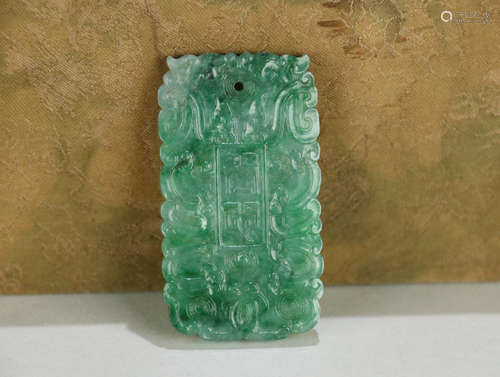 A JADEITE TABLET OF TIGER PATTERN CARVING