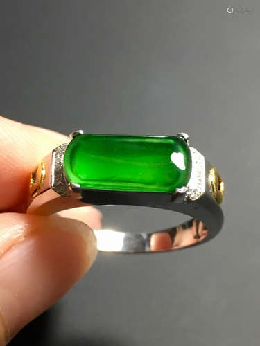 A GREEN JADEITE SADDLE SHAPED RING, TYPE A