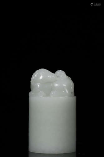 A HETIAN JADE CIRCLE SEAL WITH BEAST CARVING