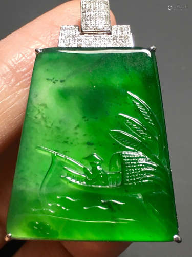 A GREEN JADEITE CARVED LANDSCAPE PENDANT, TYPE A