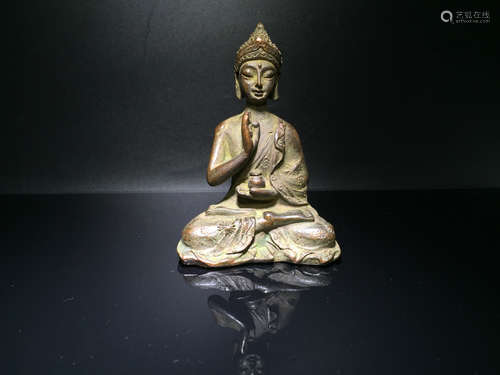 A BRONZE BUDDHA SHAPED ORNAMEN