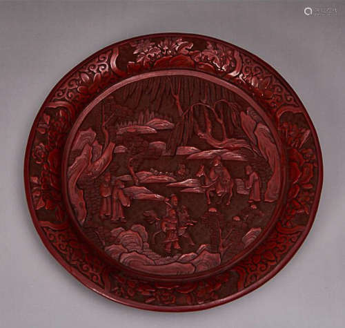 A CARVED RED LACQUER WARE PLATE WITH 