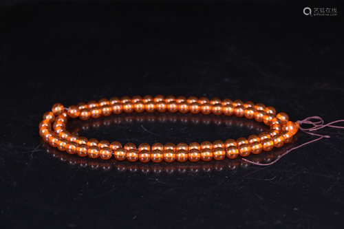 A 108 BEADS AMBER BRACELET