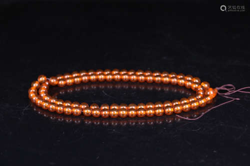 A 108 BEADS AMBER BRACELET