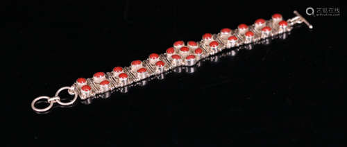 A SILVER  CORAL EMBEDED BRACELET