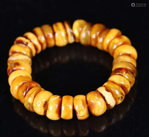 A OLD AMBER WHEEL SHAPED BEADS BARCELET