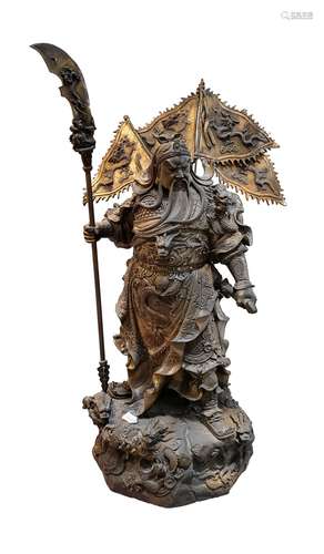 A CAST BRONZE STANDING FIGURE OF GUAN YU