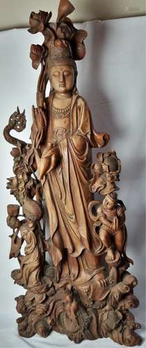 A DELICATE WOOD CARVED FIGURE OF GUANYIN