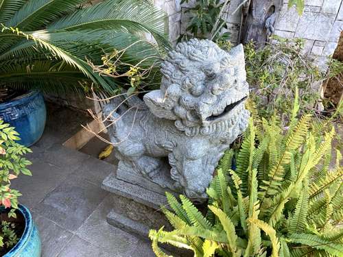 PAIR OF CARVED STONE FOO LIONS ON PEDESTALS