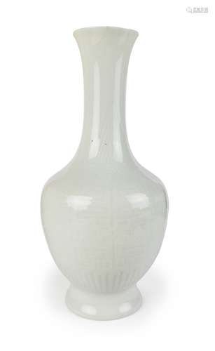 A WHITE-GLAZED CARVED ANHUA-DECORATED VASE