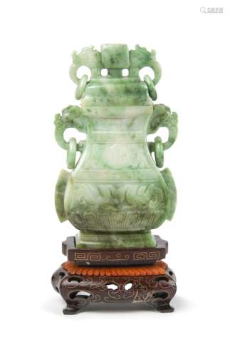 AN ARCHAISTIC JADEITE VASE AND COVER ON STAND