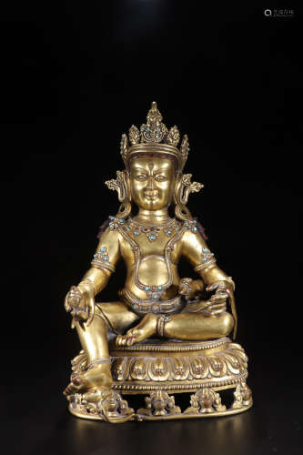 A GILT BRONZE EMBEDED WITH SONG STONE WEALTH BUDDHA