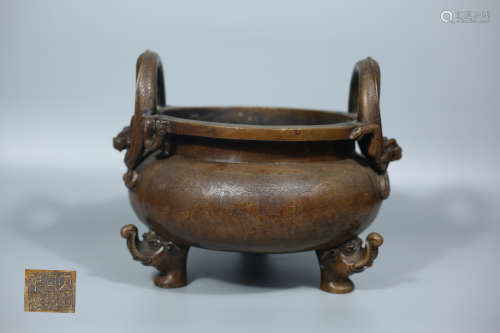 A BRONZE TRI-LEG EAR CENSER WITH XUANDE MARKING