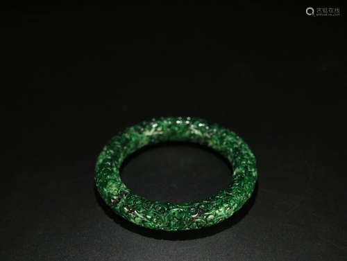 A JADEITE FLOWER PATTERN CARVED BANGLE