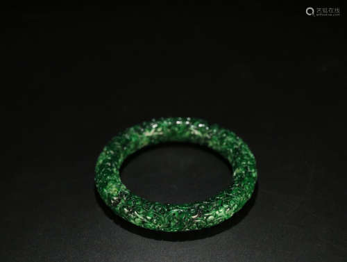 A JADEITE FLOWER PATTERN CARVED BANGLE