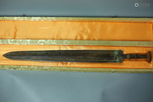 A BRONZE SWORD WITH