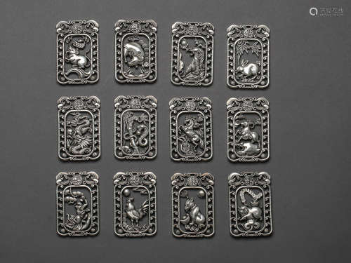 A Set of Twelve Chinese Bronze and Silver Pendant