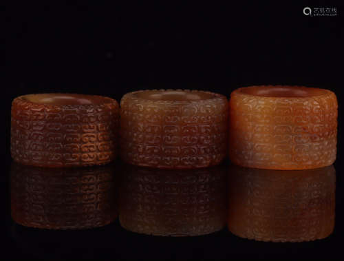 THREE ANCIENT STYLE AGATE RINGS