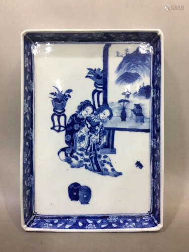 A BLUE WHITE TEA TRAY WITH CHARACTER PATTERN