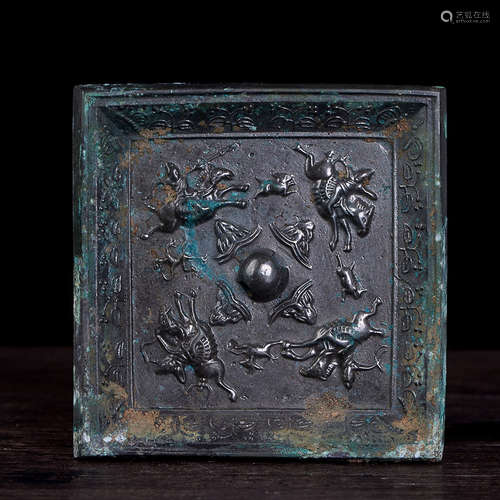 A SQUARE BRONZE MIRROR