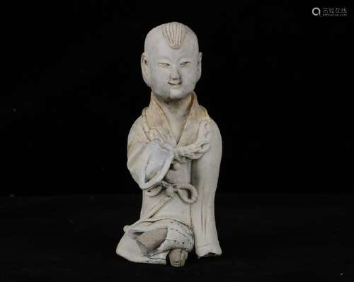 A CHINESE YING QING PORCELAIN FIGURE OF LITTLE BOY