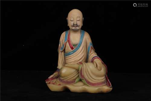 A CHINESE SOAPSTONE FIGURE OF A SEATED LUOHAN, QING